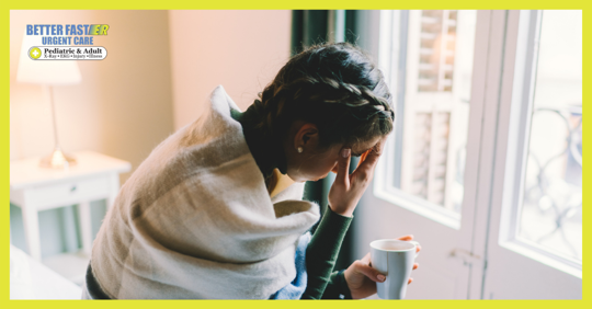 woman sick at home not feeling good allergies covid-19 or the flu drinking hot tea wrapped in blanket