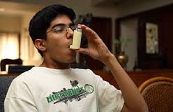 Boy using an inhaler