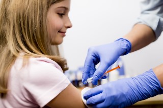 Young girl getting a shot